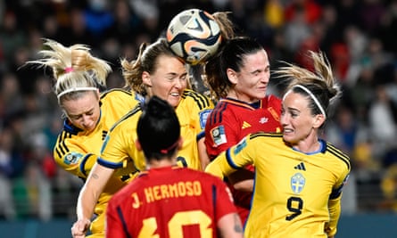 Spain and Sweden players compete in the World Cup semi-final.