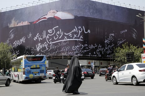 A view of a billboard in Tehran depicting US president Donald Trump lying in what appears to be a coffin.