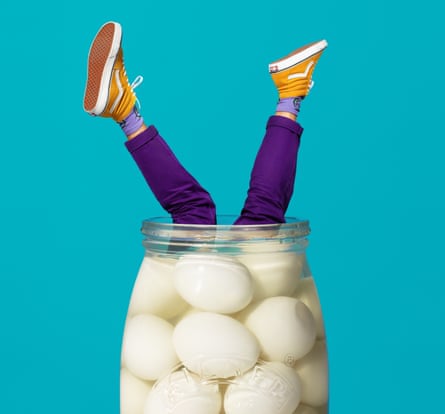 Writer Joe Stone’s legs sticking out of a jar of pickled eges