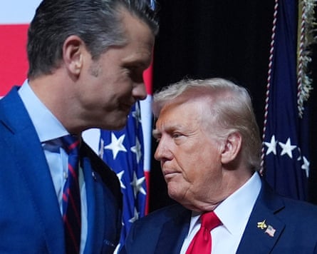 Donald Trump is greeted by Pete Hegseth before speaking to a gathering of top US military commanders in Quantico, Virginia