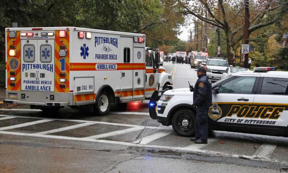An ambulance arrives at the Tree of Life synagogue where a shooter opened fire.