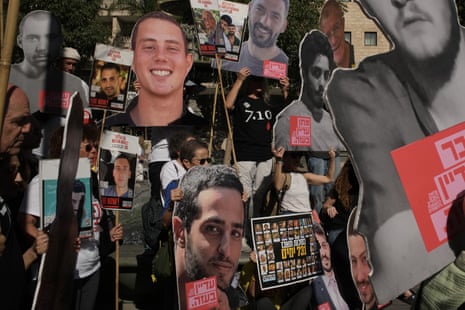 Relatives of Israeli hostages held by Hamas in the Gaza Strip hold posters with portraits of their loved ones during a protest demanding their immediate release in Jerusalem.