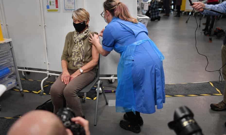 A woman receives her Covid-19 vaccine at an NHS centre in Birmingham