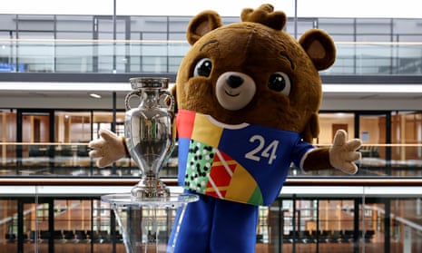 The Euro 2024 trophy is seen at Hans-Sachs-Haus, town hall of Gelsenkirchen, along with tournament mascot Albärt.