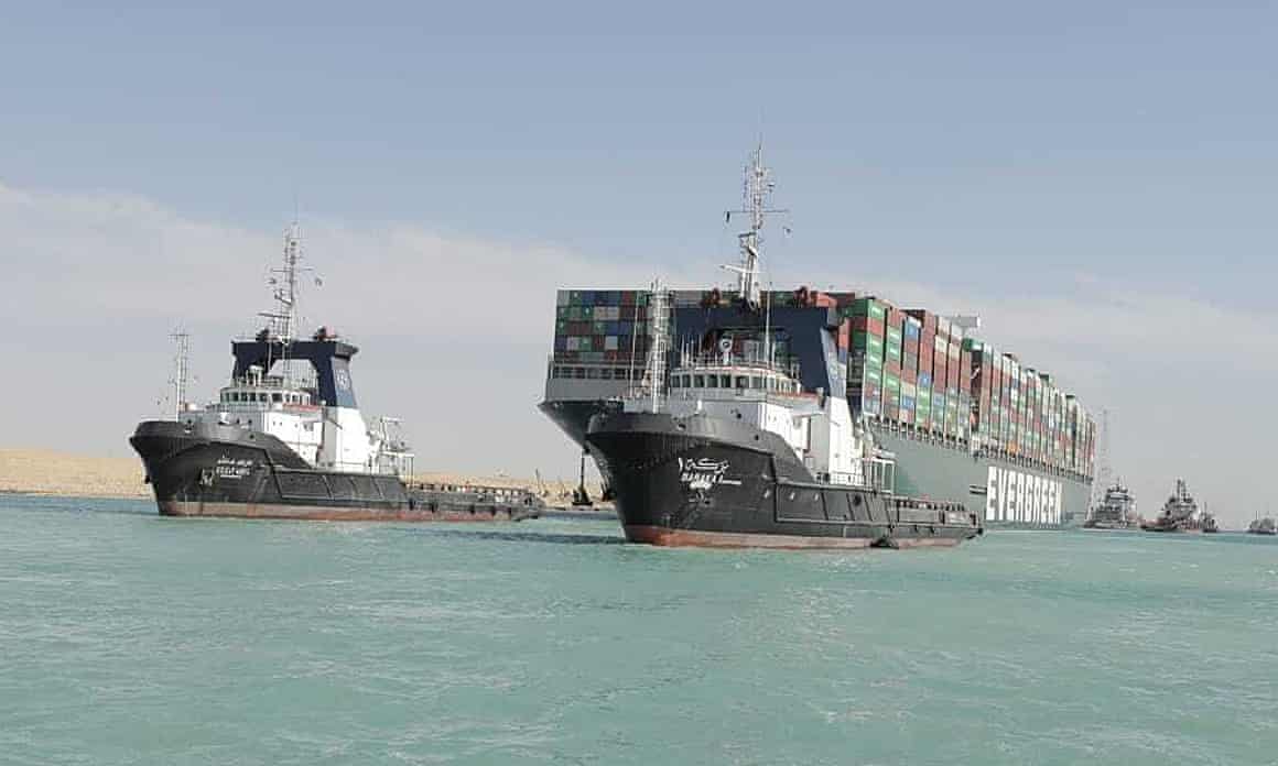 The Ever Green with tugboats
