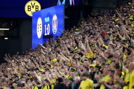 Borussia Dortmund fans celebrate their team’s victory over PSG.