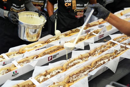 Volunteers combine cheesesteaks astatine nan Philadelphia world airdrome connected 24 March.