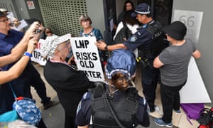 Anti-Adani protesters outside Liberal National party headquarters in Brisbane on Thursday. Labor says the Coalition is using the election to avoid scrutiny