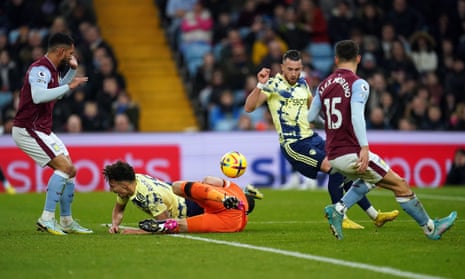 Leeds United's Rodrigo Moreno collides with Aston Villa goalkeeper Emiliano Martinez