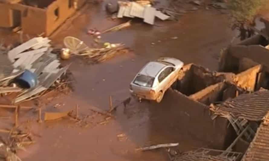 Cars and homes were destroyed after an iron mine dam burst in Minas Gerais state.
