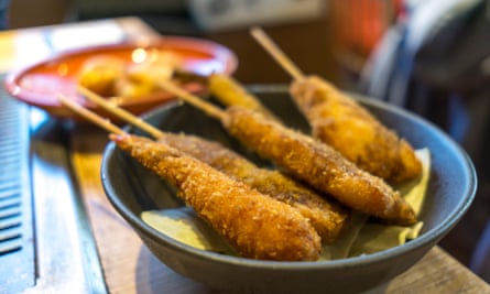 kushikatsu is breaded fried things on sticks.