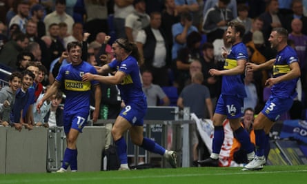 ‘The odds were all against me’: Ali al-Hamadi’s odyssey from Iraq to AFC Wimbledon | AFC Wimbledon 5 Ryan McLean celebrates AFC Wimbledon’s injury-time winner against Coventry in the Carabao Cup first round