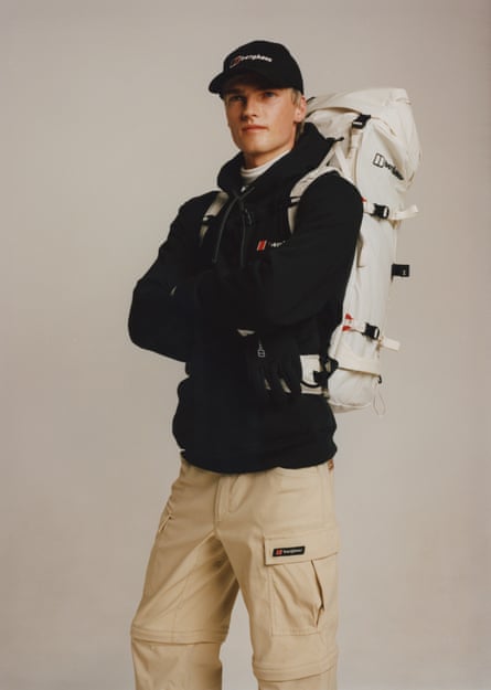 A male model in Berghaus clothing with rucksack