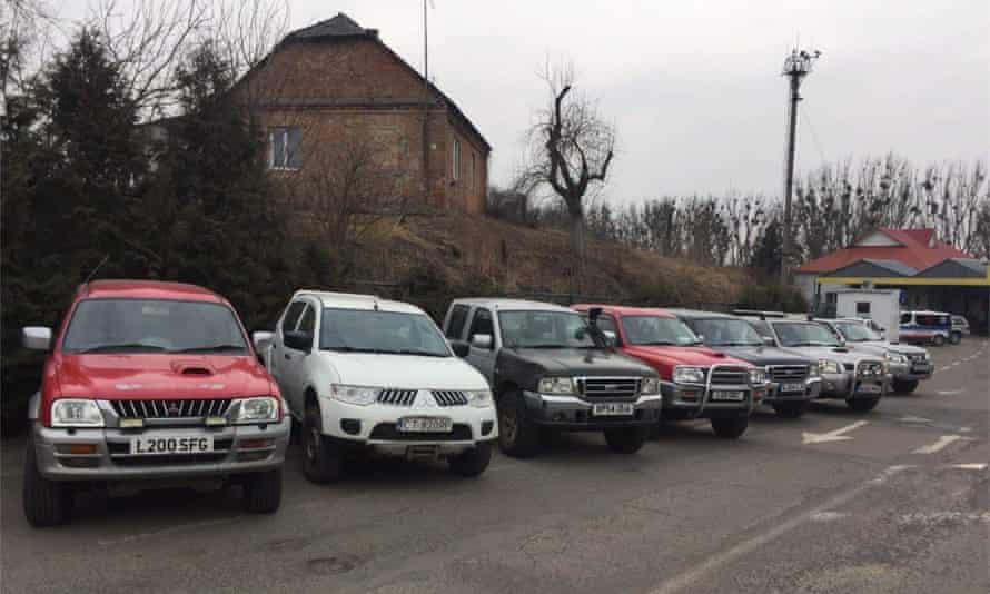 Used British cars are transported to the front line of war in Ukraine.