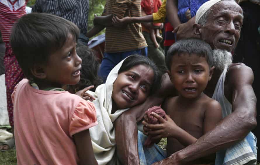 Muslim Rohingyas in Ghumdhum, Cox’s Bazar weep as Bangladesh border guards order them to leave their makeshift camp and the country in August 2017.