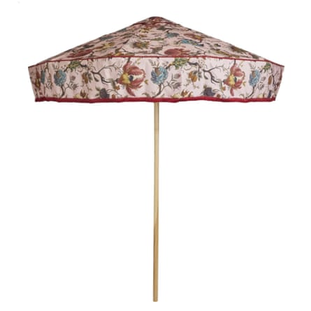 An Artemis Parasol from house of hackney. It is pink with a floral design