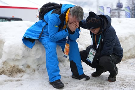 Mykhailo Heraskevych, father of skeleton athlete Vladyslav, sits next to the start house of the sliding centre in Cortina