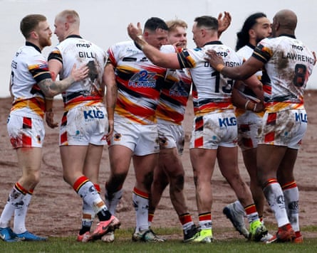 Matty Gee is congratulated by teammates after scoring for Bradford Bulls in the Challenge Cup