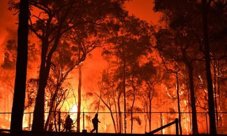 RFS volunteers and NSW Fire and Rescue officers at the Gospers Mountain fire 19 November 2019.