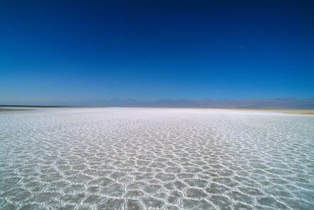 A salt flat stretches to the horizon.