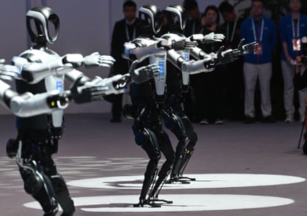 Humanoid robots perform at the opening ceremony of the 2025 Zhongguancun Forum (ZGC Forum) Annual Conference, in Beijing, capital of China, March 27, 2025.