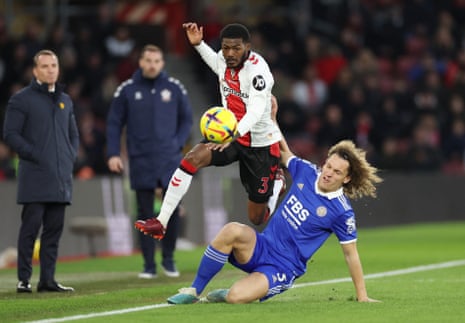 Ainsley Maitland-Niles goes past the lunging Wout Faes.