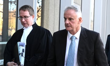 Mark Latham leaves during a break in proceedings at the Federal Court