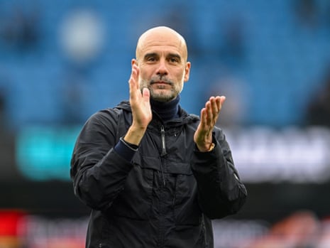 Manchester City manager Pep Guardiola applauds fans at the Etihad Stadium