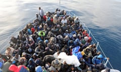 Migrants are seen in a boat as they are rescued by Libyan coast guards in the Mediterranean Sea off the coast of Libya, January 15, 2018. Picture taken January 15, 2018. REUTERS/Hani Amara