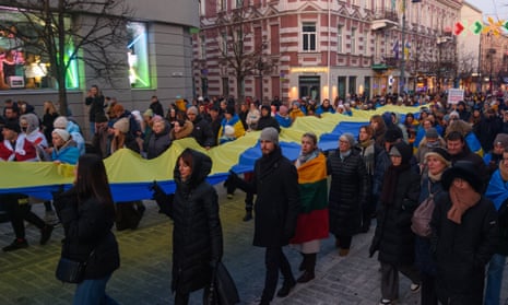 People attend a demonstration against Russia's war on Ukraine to mark the third anniversary of the war, in Vilnius, Lithuania, Sunday, 23 February, 2025.
