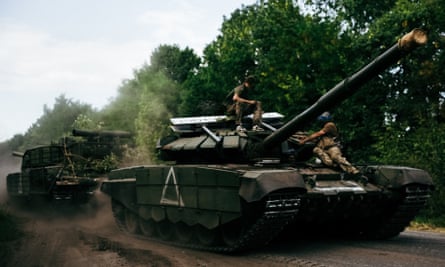 Ukrainian forces towing a tank.