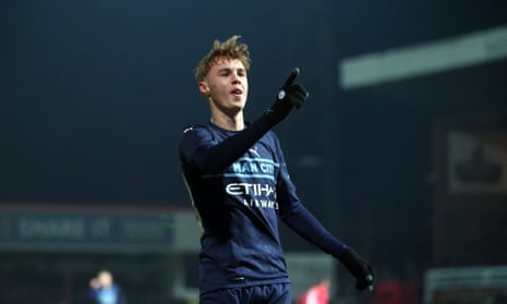 Cole Palmer celebrates scoring the fourth for Manchester City.