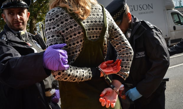 Officers arrest an activist during the Extinction Rebellion protest in London last week.