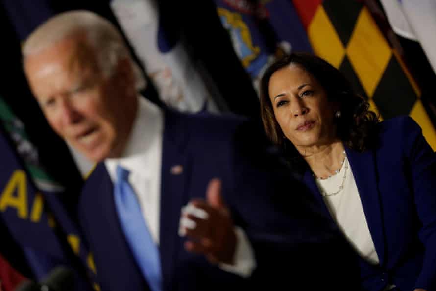 Harris listens as Joe Biden speaks at a campaign event, their first joint appearance since Biden named Harris as his running mate, on Wednesday.