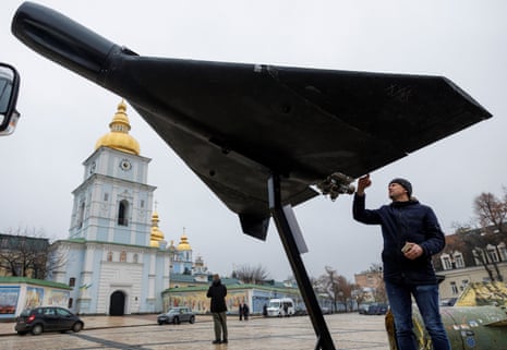 A resident touches a Russian-Iranian Shahed-136 (Geran-2) kamikaze drone installed in front of Saint Michael’s Cathedral in Kyiv.
