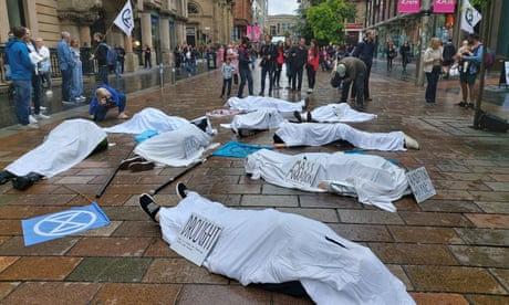 Extinction Rebellion of climate activists staging a "die-in" protest in Glasgow's city centre