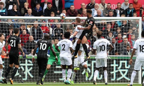 Jamaal Lascelles rises above the Swansea defence to put Newcastle 1-0 up late on at the Liberty Stadium. 