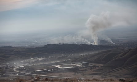 Smoke rises above Sinjar in November 2015 after it was recaptured from Isis.