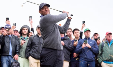 Tiger Woods plays his second shot on the 11th hole