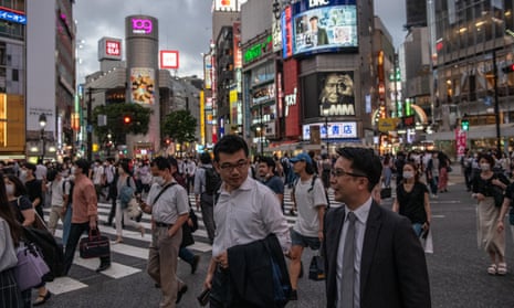 People walk through Shibuya on 23 June 2020 in Tokyo, Japan.