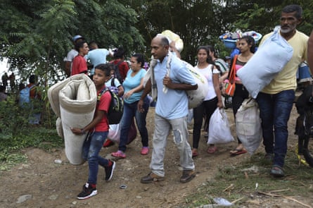 Venezuelans seek shelter in Colombia following clashes between Venezuela’s military and a Colombian armed group.