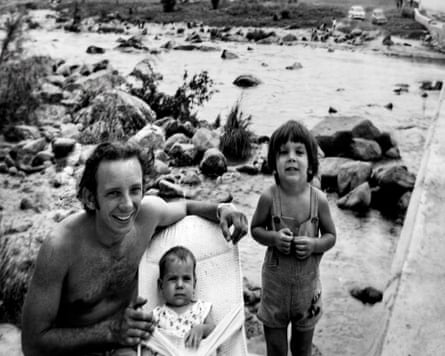 a man with two children outdoors