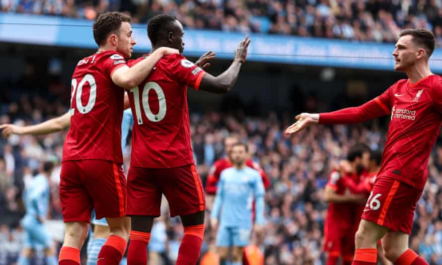 Sadio Mané is congratulated by his teammates after scoring Liverpool’s second goal at the Etihad.