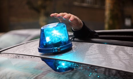 Blue light on roof of an undercover police car.