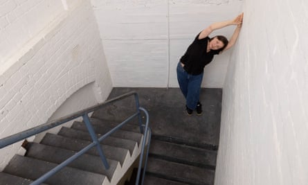 Emma bends like a banana in a windowless stairwell