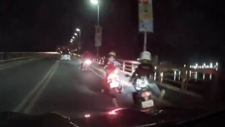 Dashcam footage shows people rocked off their bikes as earthquake shakes the Philippines – video