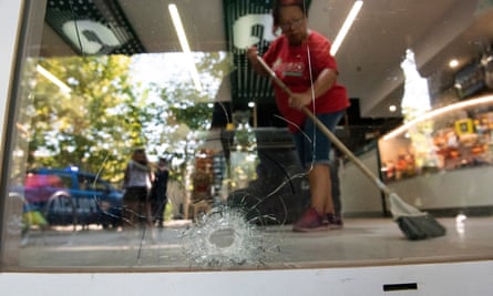 Staff clean up after the attack on the supermarket in Rosario