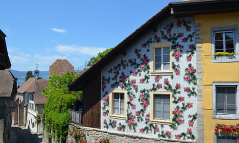 A design of pink roses fixed to a house in Switzerland.