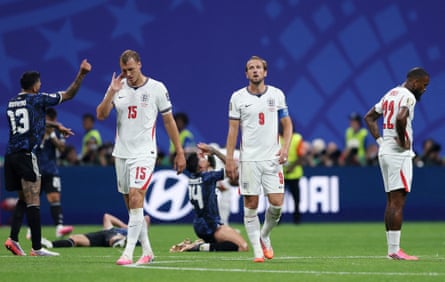 England players look dejected after the semi-final defeat by Argentina