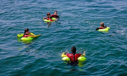 Lifeguards playing casualties during the exercise show the horseshoe float.